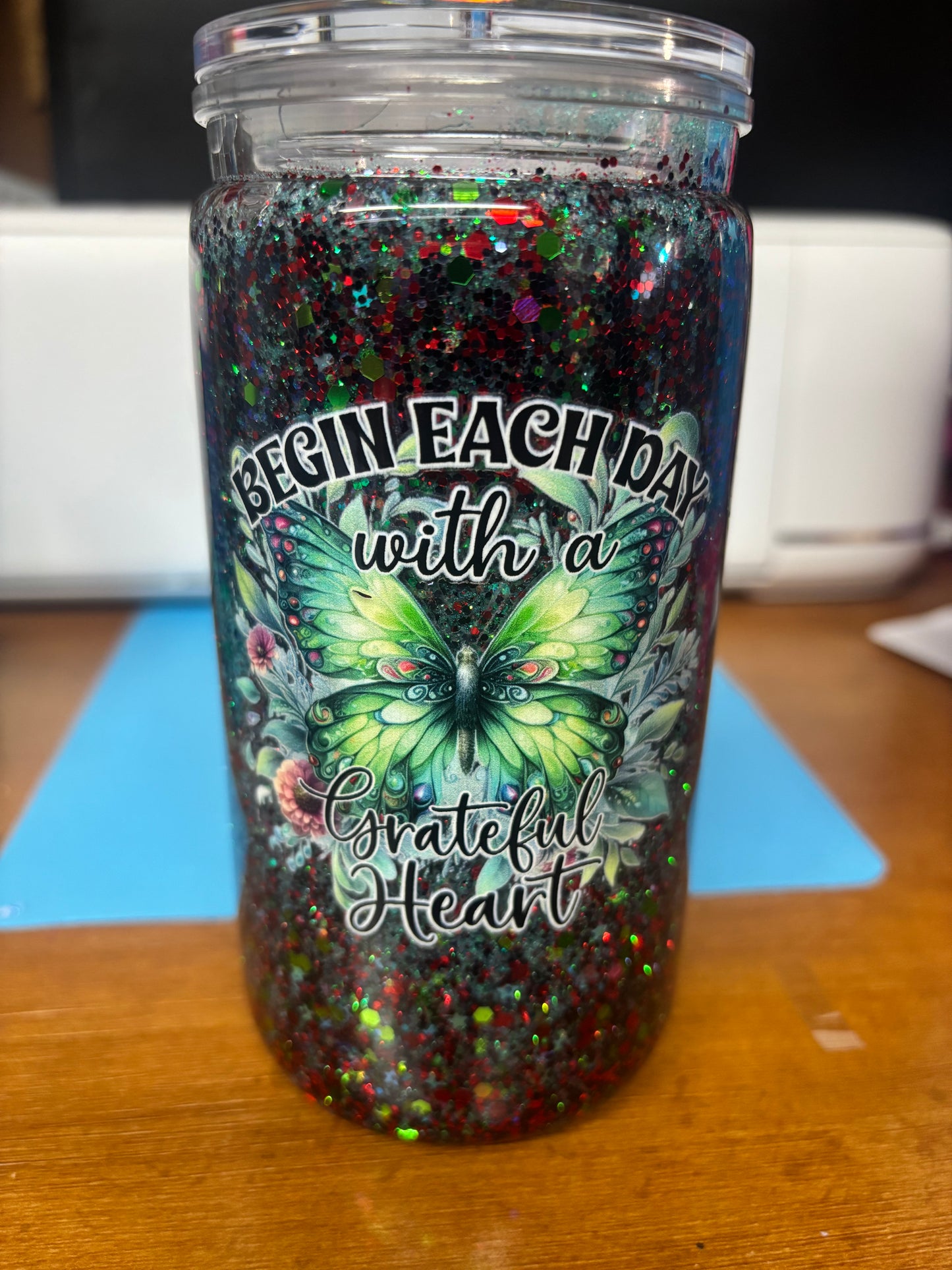 green and red sparkly butterfly snow globe cups